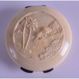 A LATE 19TH CENTURY CONTINENTAL CARVED IVORY COMPACT decorated with an elephant within a landscape.