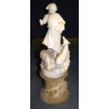 A 19TH CENTURY CARVED ALABASTER FIGURE OF A STANDING FEMALE modelled upon a pedestal. 61 cm high.