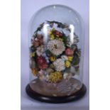 A LARGE VICTORIAN FLORAL TAXIDERMY TYPE GROUP, contained with a glass dome upon fitted base. 45 cm h