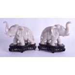 A PAIR OF 19TH CENTURY CHINESE CARVED WHITE JADE ELEPHANTS Daoguang. 15 cm x 18 cm. Note: Sold with