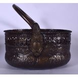 A HAMMERED COPPER SWING HANDLED BASKET, decorated in relief with panels of foliage. 26 cm wide.
