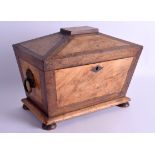 A VICTORIAN CARVED WALNUT TWIN DIVISION TEA CADDY with cut glass mixing bowl, upon half bun feet. 30