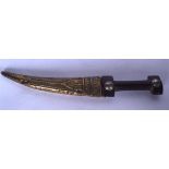 AN EARLY 20TH CENTURY EASTERN DAGGER, formed with a wooden handed and engraved sheath. 31 cm.