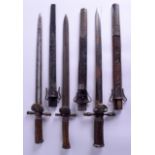 A GROUP OF THREE ANTIQUE GERMAN BAVARIAN KULL LONG DAGGERS with antler horn handles. Largest 52 cm l