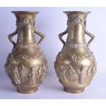 A LARGE PAIR OF 19TH CENTURY CHINESE TWIN HANDLED BRONZE VASES bearing Xuande marks to base, decorat