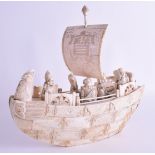 A LARGE 19TH CENTURY JAPANESE MEIJI PERIOD CARVED IVORY BOAT modelled as five immortals upon the dec