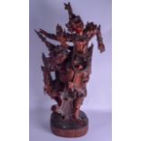 A LARGE 19TH CENTURY SOUTH EAST ASIAN HARDWOOD FIGURE modelled as a Buddhistic beast holding aloft a
