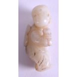 A 19TH CENTURY CHINESE CARVED GREYISH WHITE JADE FIGURE OF A BOY modelled holding a lotus flower. 5.