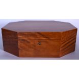 A LARGE OCTAGONAL SHAPED WOODEN BOX, formed with swan neck brass handles and with original key. 45.5