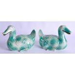 AN UNUSUAL PAIR OF EARLY 20TH CENTURY CHINESE GREEN GLAZED DUCKS bearing Qianlong marks to base. 16