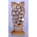 AN EARLY 20TH CENTURY CHINESE MOTHER OF PEARL SEAL OR STAMP, carved with fruiting vines. 5.6 cm high