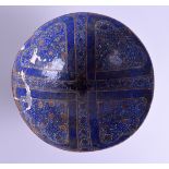 AN ISLAMIC MIDDLE EASTERN KASHAN BOWL painted with copper motifs upon a scrolling gilt ground. 24 cm