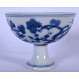 A 20TH CENTURY CHINESE BLUE AND WHITE PORCELAIN STEM CUP, decorated with flowering vines. 6.5 cm hi