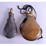 AN ANTIQUE CARVED HORN AND BRASS SHOT POWDER FLASK together with another metal flask, decorated with