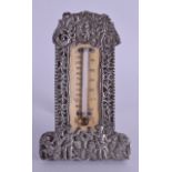AN UNUSUAL VICTORIAN SILVER AND HORN STRUT THERMOMETER decorated with putti amongst landscapes. Lond