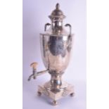 A LARGE GEORGE III SILVER TEA URN decorated with a central crest and floral bands. 54.7 oz. 48 cm x