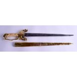 AN EARLY 20TH CENTURY MIDDLE EASTERN MUGSHAL SHORT SWORD with elephant head terminal. 51 cm long.