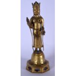 A 20TH CENTURY CHINESE GILT BRONZE STATUE OR BUDDHA, formed standing holding ritual objects upon an