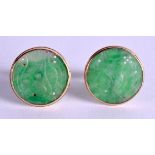 AN UNUSUAL PAIR OF EARLY 20TH CENTURY CHINESE JADEITE CUFFLINKS within yellow metal mounts. 2 cm dia