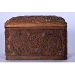 AN UNSEAL ANGLO INDIAN CARVED WOODEN CIGARETTE BOX, decorated with extensive foliage. 14.5 cm wide.