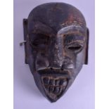 AN EARLY 20TH CENTURY AFRICAN TRIBAL CARVED HARDWOOD MASK. 15 cm x 24 cm.