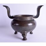 AN 18TH/19TH CENTURY CHINESE TWIN HANDLED BRONZE CENSER Qing, bearing extensive calligraphy to base.