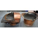 AN ANTIQUE COPPER COAL SCUTTLE, together with another similar. Largest 57 cm.