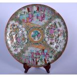 A 19TH CENTURY CHINESE FAMILLE ROSE CANTON PORCELAIN DISH OR PLATE, painted with panels of figures i