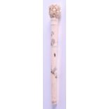 A 19TH CENTURY JAPANESE MEIJI PERIOD SHIBAYMA INLAID IVORY PARASOL HANDLE formed with mask heads and