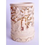 A 19TH CENTURY CHINESE CANTON CARVED IVORY BRUSH POT Qing, decorated with figures within landscapes.