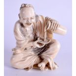 A GOOD 19TH CENTURY JAPANESE MEIJI PERIOD CARVED IVORY OKIMONO modelled as a male pouring liquid. 8.