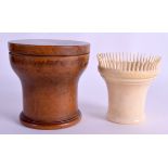 A RARE MID 19TH CENTURY TREEN CASED IVORY SPIKED COMBING DEVICE within its original fitted box. 9 cm