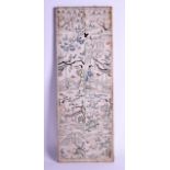 A 19TH CENTURY CHINESE FRAMED SILKWORK PANEL depicting figures in various pursuits. 50 cm x 18 cm.