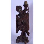 A LARGE EARLY 20TH CENTURY CHINESE HARDWOOD FIGURAL LAMP OR STATUE, carved in the form of a standing