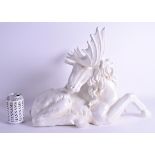 A LARGE CONTINENTAL PORCELAIN GROUP OF A RECUMBANT MOOSE modelled with its head turned. 52 cm x 37 c