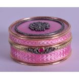 A RUSSIAN 14CT GOLD DIAMOND AND PINK ENAMEL CIRCULAR BOX decorated with a motif to the top. 132.6 gr