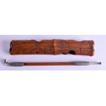 A 19TH CENTURY CHINESE CARVED BAMBOO OPIUM PIPE decorated with lotus flowers. 21 cm long.