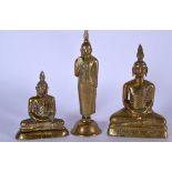 THREE MID 20TH CENTURY BRASS BUDDHA OR STATUE, one formed standing and the other two seated upon tri