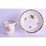 AN 18TH CENTURY JAMES GILES GILDED WORCESTER COFFEE CUP AND SAUCER painted with flowers under a sawt