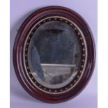 AN EARLY 19TH CENTURY ROSEWOOD MIRROR with gold star decoration. 28 cm x 32 cm.