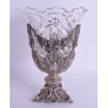 A LARGE 19TH CENTURY CONTINENTAL SILVER PLATED CUT GLASS VASE formed within floral swags and acanthu