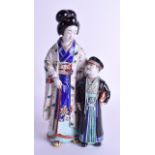 A RARE 19TH CENTURY JAPANESE AO KUTANI FIGURE OF A GEISHA modelled standing beside a male in black c