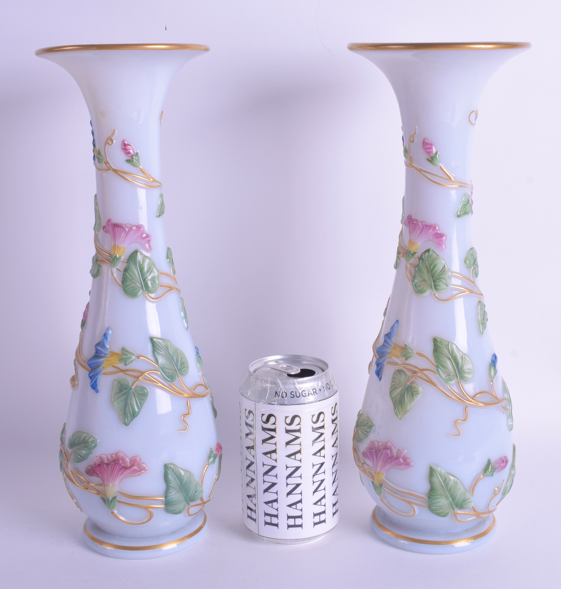 A FINE PAIR OF 19TH CENTURY BACCARAT OPALINE GLASS VASES overlaid with trailing vines and foliage. 3