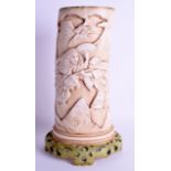 A RARE 19TH CENTURY CONTINENTAL IMITATING IVORY PORCELAIN BRUSH POT decorated with figures holding f