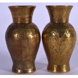 A PAIR OF EARLY 20TH CENTURY EASTERN BRASS VASES, decorated with extensive foliage. 9.2 cm.