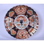 A LARGE JAPANESE MEIJI PERIOD PORCELAIN IMARI LOBED DISH, decorated with panels of birds and foliage