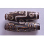 A PAIR OF 19TH CENTURY CHINESE GOLD INLAID AGATE ZHU BEADS. 4 cm long.