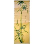 AN EARLY 20TH CENTURY CHINESE SCROLL by Shi Song, depicting emerging green foliage. Image 88 cm x 30