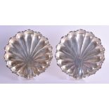 A PAIR OF ANTIQUE CONTINENTAL WHITE METAL SHELL SHAPED DISHES. 22.8 oz. 19 cm x 19 cm.