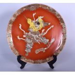 A JAPANESE MEIJI PERIOD SATSUMA POTTERY DISH, painted with a warrior and flanked foliate inspired bo